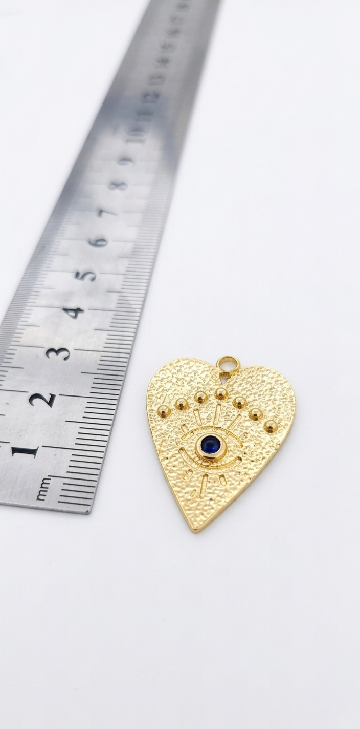 Dije corazon ojo y circón
