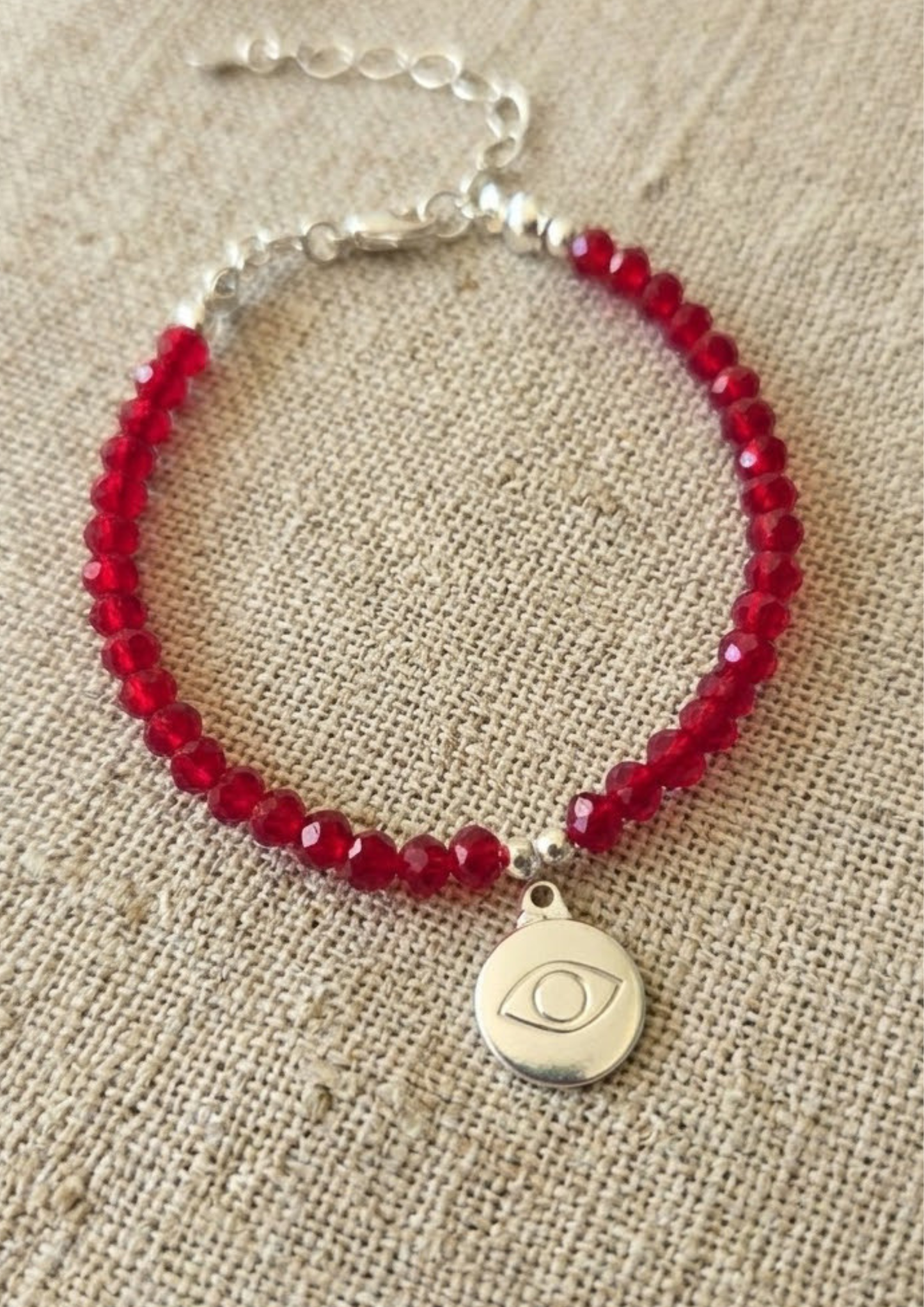 Pulsera cristales y dije ojo baño plata